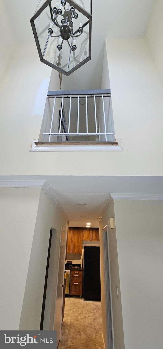 interior space with crown molding