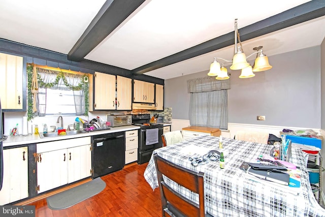 kitchen with black appliances, sink, dark hardwood / wood-style floors, decorative light fixtures, and beam ceiling