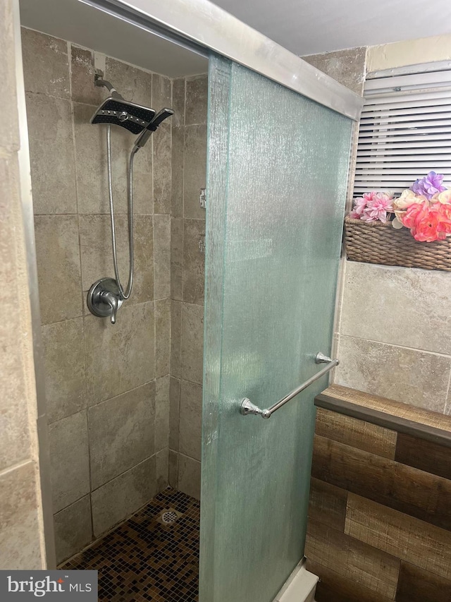 bathroom featuring an enclosed shower