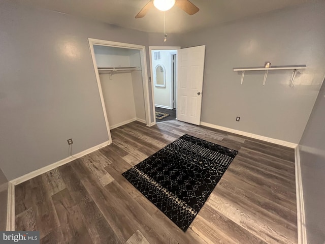 bedroom featuring a closet, dark hardwood / wood-style floors, and ceiling fan