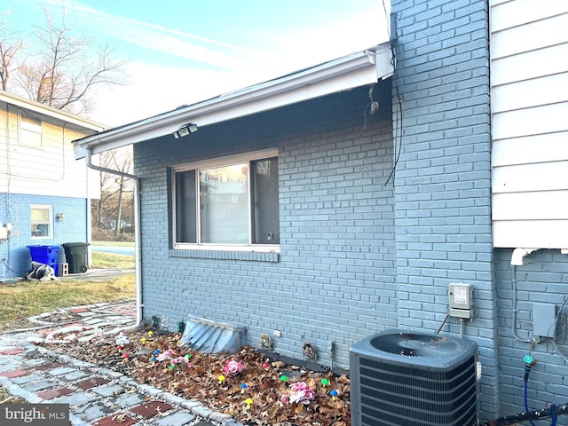 view of property exterior featuring central AC