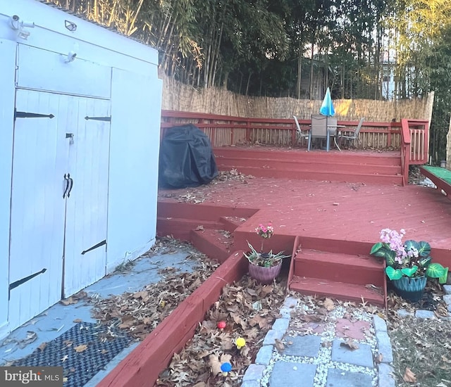 wooden deck with grilling area