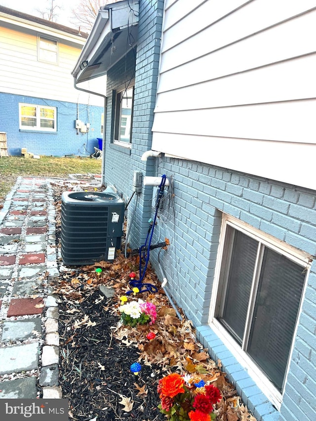 view of side of property featuring central air condition unit