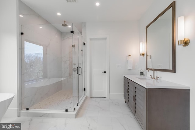 bathroom with vanity and an enclosed shower