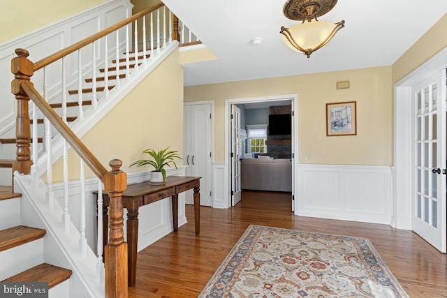 foyer entrance with dark wood-type flooring