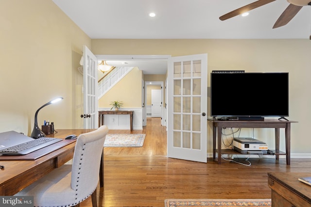 office space with ceiling fan, french doors, and hardwood / wood-style flooring