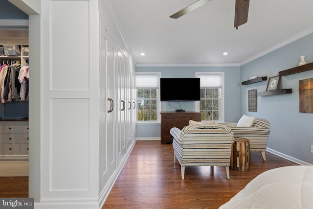 bedroom featuring ceiling fan, dark hardwood / wood-style flooring, a closet, and ornamental molding