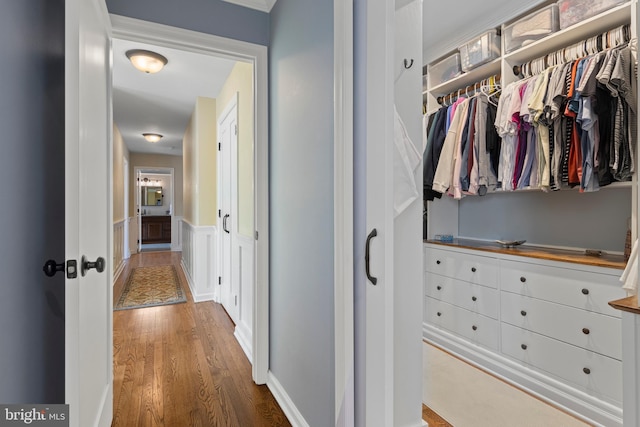 corridor featuring hardwood / wood-style floors