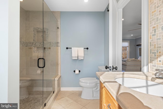 bathroom featuring tile patterned floors, vanity, toilet, walk in shower, and ornamental molding