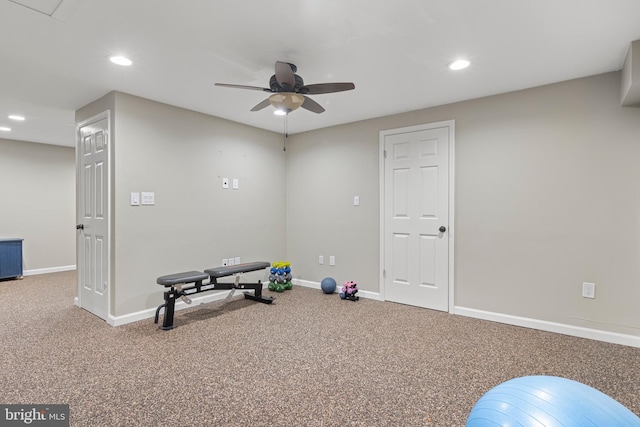 workout area featuring ceiling fan and carpet flooring