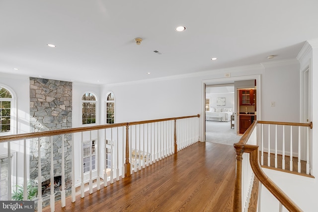 hallway with crown molding and wood-type flooring