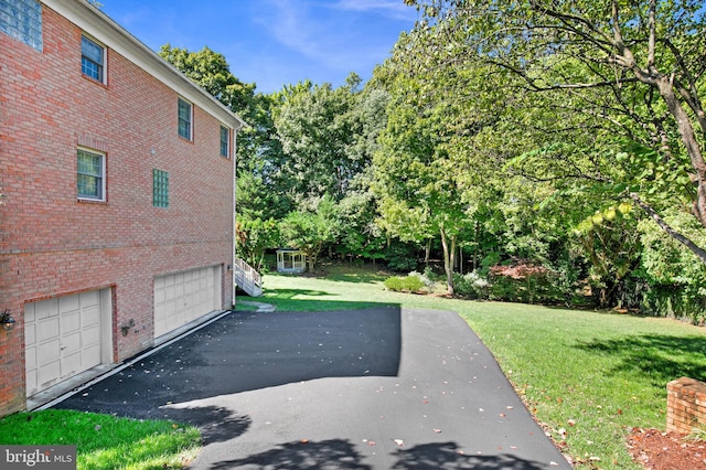 view of yard with a garage