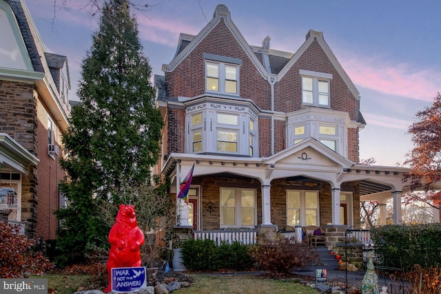 victorian home featuring covered porch