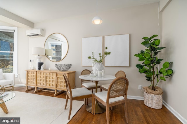 dining space featuring dark wood-type flooring and a wall mounted AC