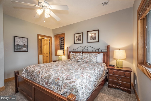 bedroom with dark colored carpet and ceiling fan