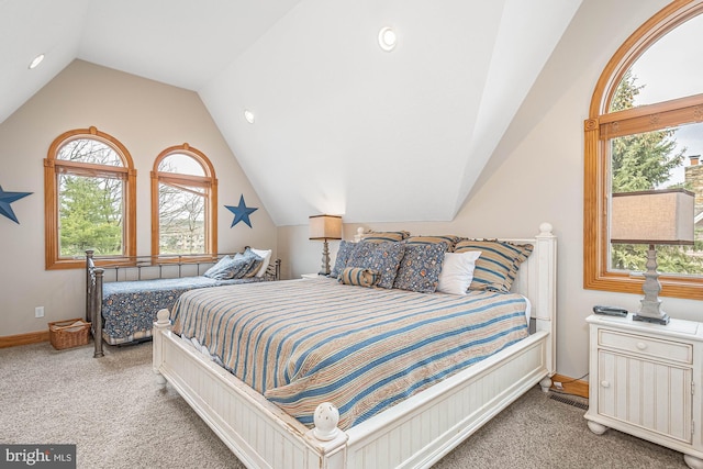 bedroom featuring light carpet and lofted ceiling