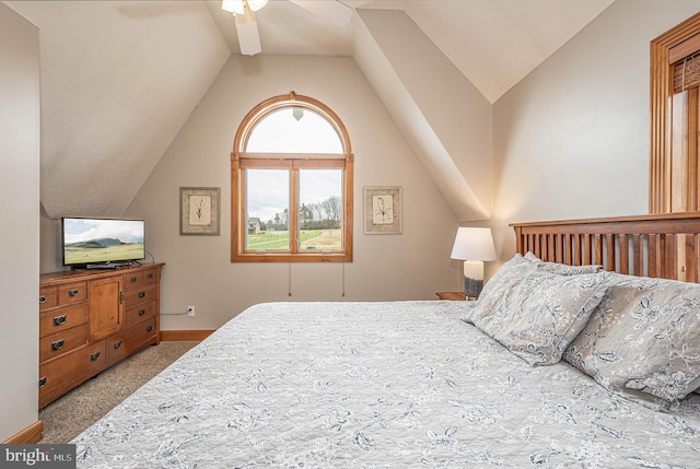 bedroom with ceiling fan, carpet floors, and lofted ceiling