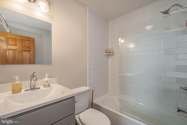 full bathroom with vanity, toilet, and tiled shower / bath