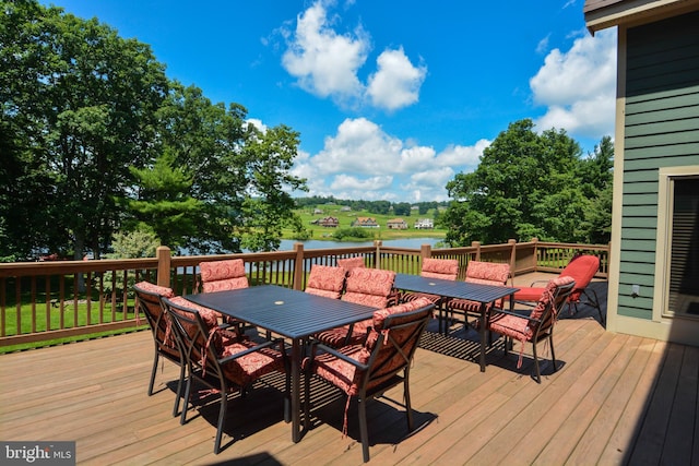 wooden terrace featuring a water view