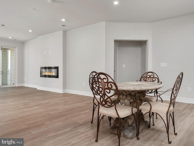 dining space featuring light hardwood / wood-style flooring