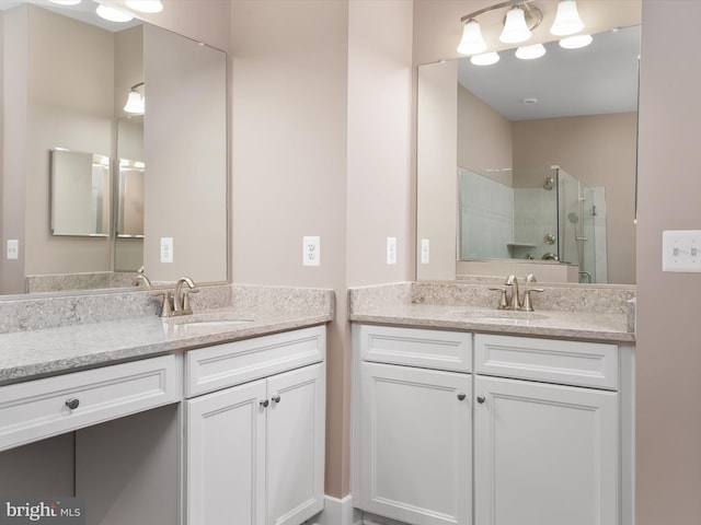 bathroom featuring a stall shower, two vanities, and a sink