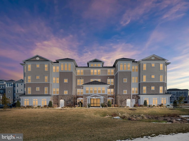 view of outdoor building at dusk