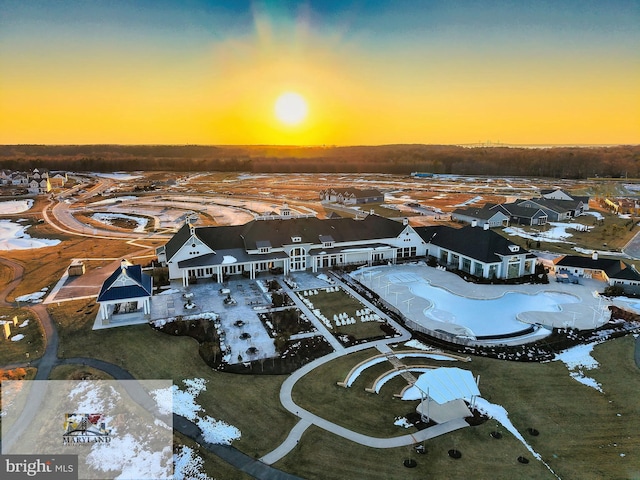 aerial view at dusk featuring a residential view