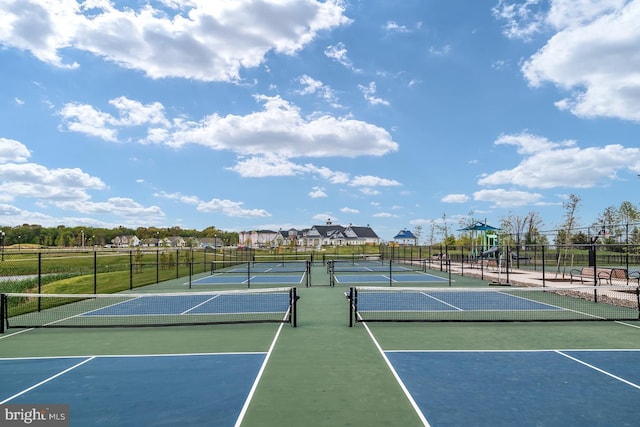 view of sport court with a playground