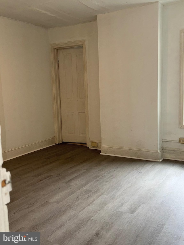 spare room featuring hardwood / wood-style flooring