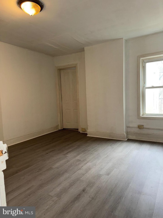 spare room with hardwood / wood-style flooring