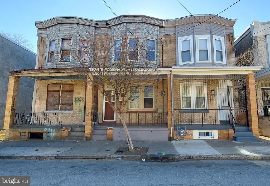 view of property featuring a porch