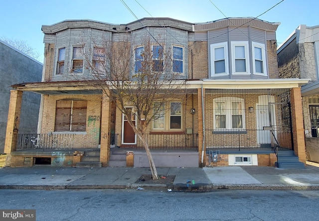 view of property featuring a porch