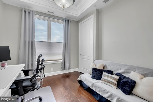 office with dark hardwood / wood-style floors and ornamental molding