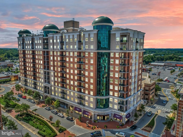 view of outdoor building at dusk