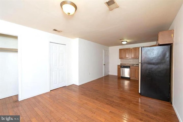 kitchen with decorative backsplash, dishwasher, refrigerator, and dark wood-type flooring