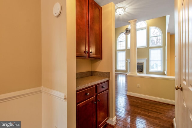 kitchen featuring dark wood-type flooring and ceiling fan