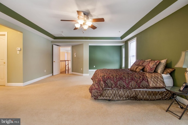 bedroom with ceiling fan and light colored carpet