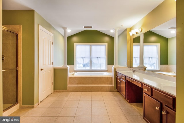 bathroom featuring vaulted ceiling, vanity, independent shower and bath, and tile patterned flooring