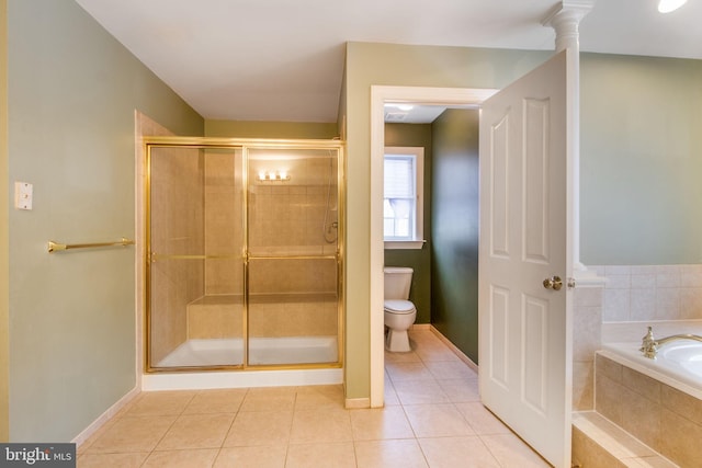 bathroom with toilet, tile patterned flooring, plus walk in shower, and ornate columns