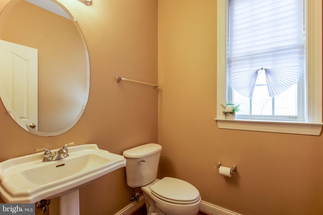 bathroom featuring toilet and sink