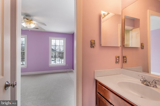 bathroom featuring ceiling fan and vanity