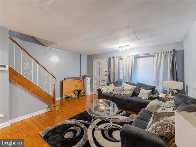 living room featuring hardwood / wood-style flooring and track lighting