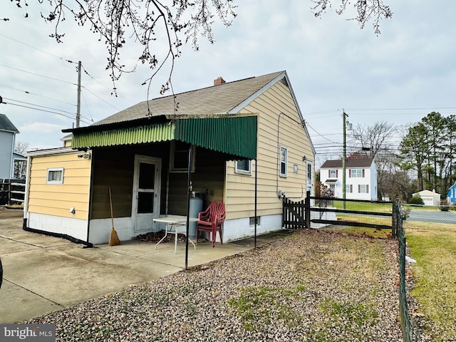 view of property exterior with a patio