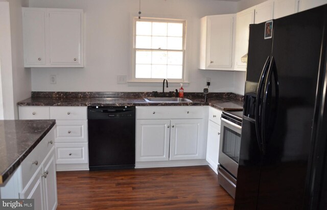 kitchen featuring dark wood-type flooring, sink, black appliances, dark stone countertops, and white cabinets