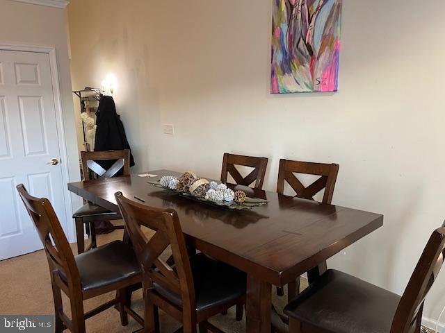 view of carpeted dining area