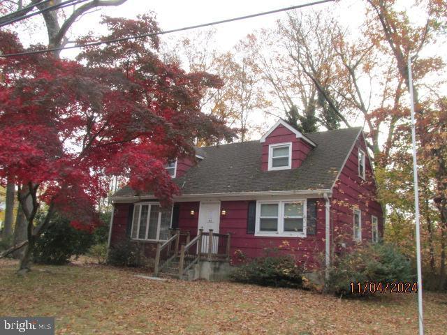 view of new england style home