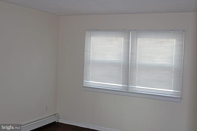 spare room featuring a baseboard radiator