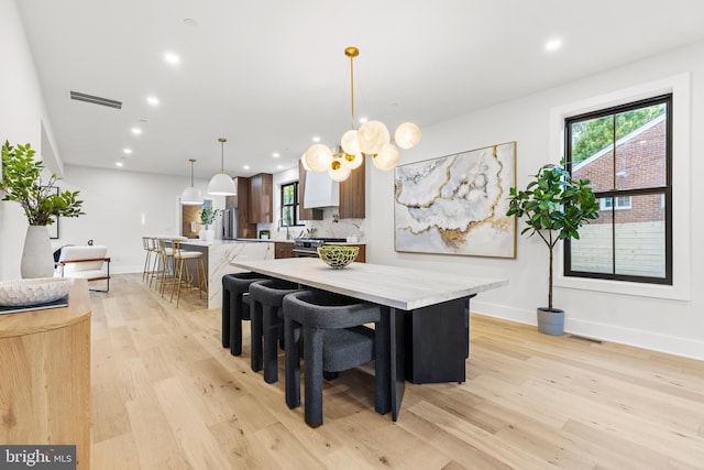 8206 Grubb Rd, Chevy Chase, MD 20815 - dining space featuring light wood-type flooring, recessed lighting, and baseboards