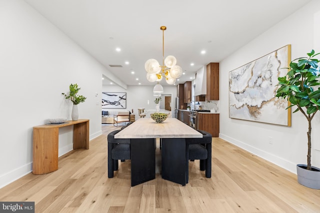 8206 Grubb Rd, Chevy Chase, MD 20815 - dining space featuring recessed lighting, light wood-style flooring, a chandelier, and baseboards