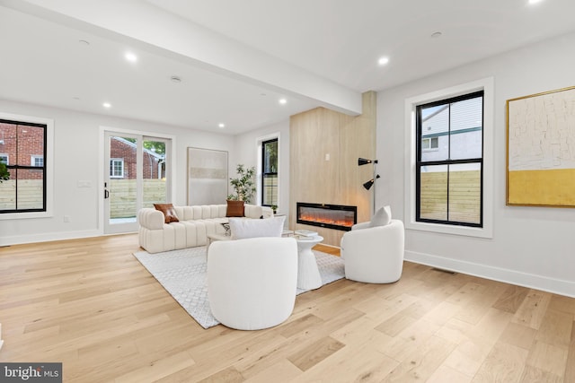8206 Grubb Rd, Chevy Chase, MD 20815 - living room featuring light wood-type flooring, baseboards, a fireplace, recessed lighting, and beamed ceiling